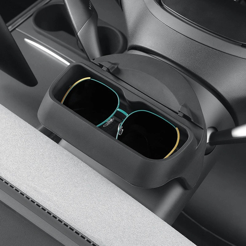 Car organizer tray with sunglasses inside, placed on a car's console.